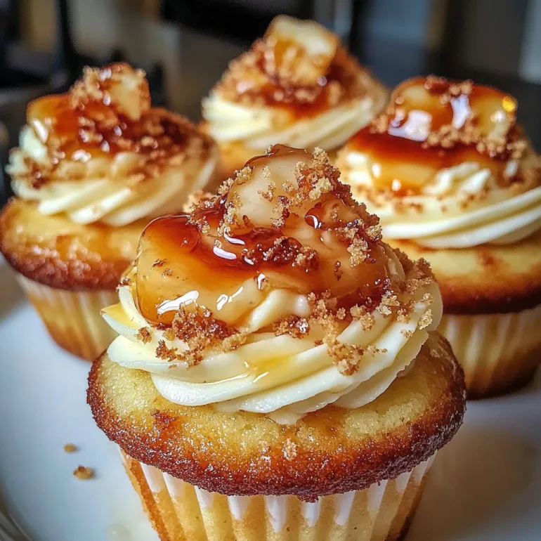 Three cupcakes with vanilla bean crème brûlée cheesecake toppings.