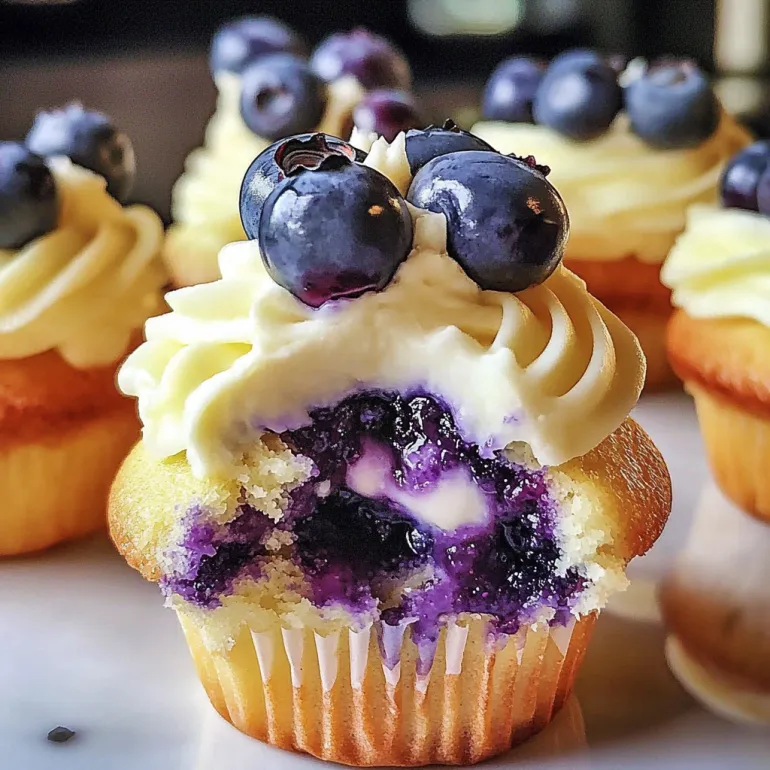 A cupcake with blueberry lime cheesecake filling.