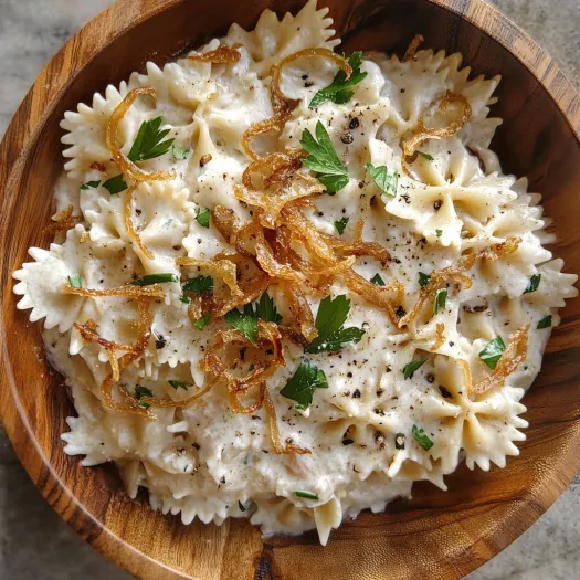 A bowl of French onion pasta salad.