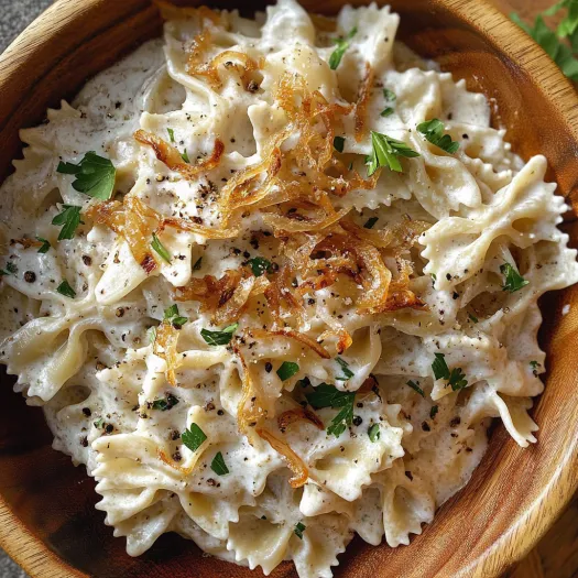 A bowl of French onion pasta salad.