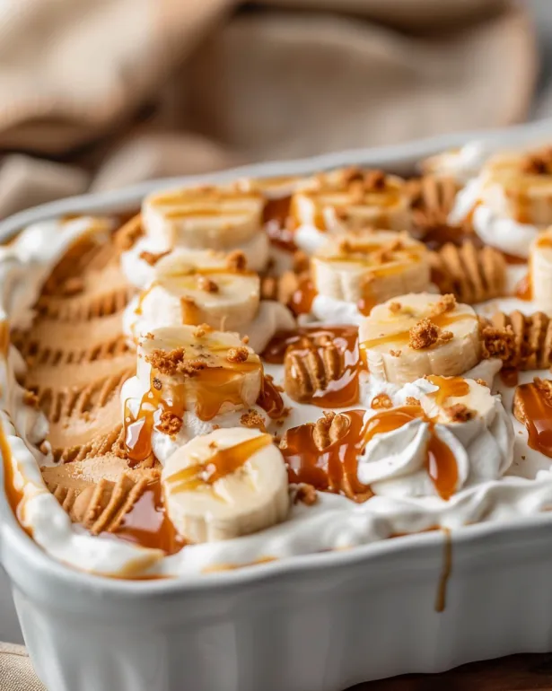 A dessert with bananas and caramel sauce.