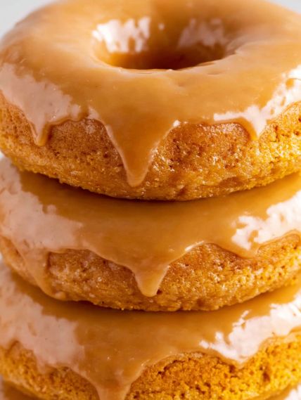 Three donuts stacked on top of each other.