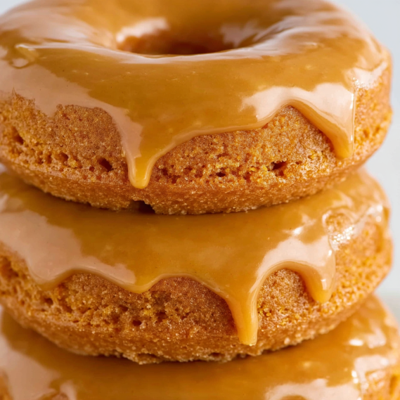 Three donuts stacked on top of each other.